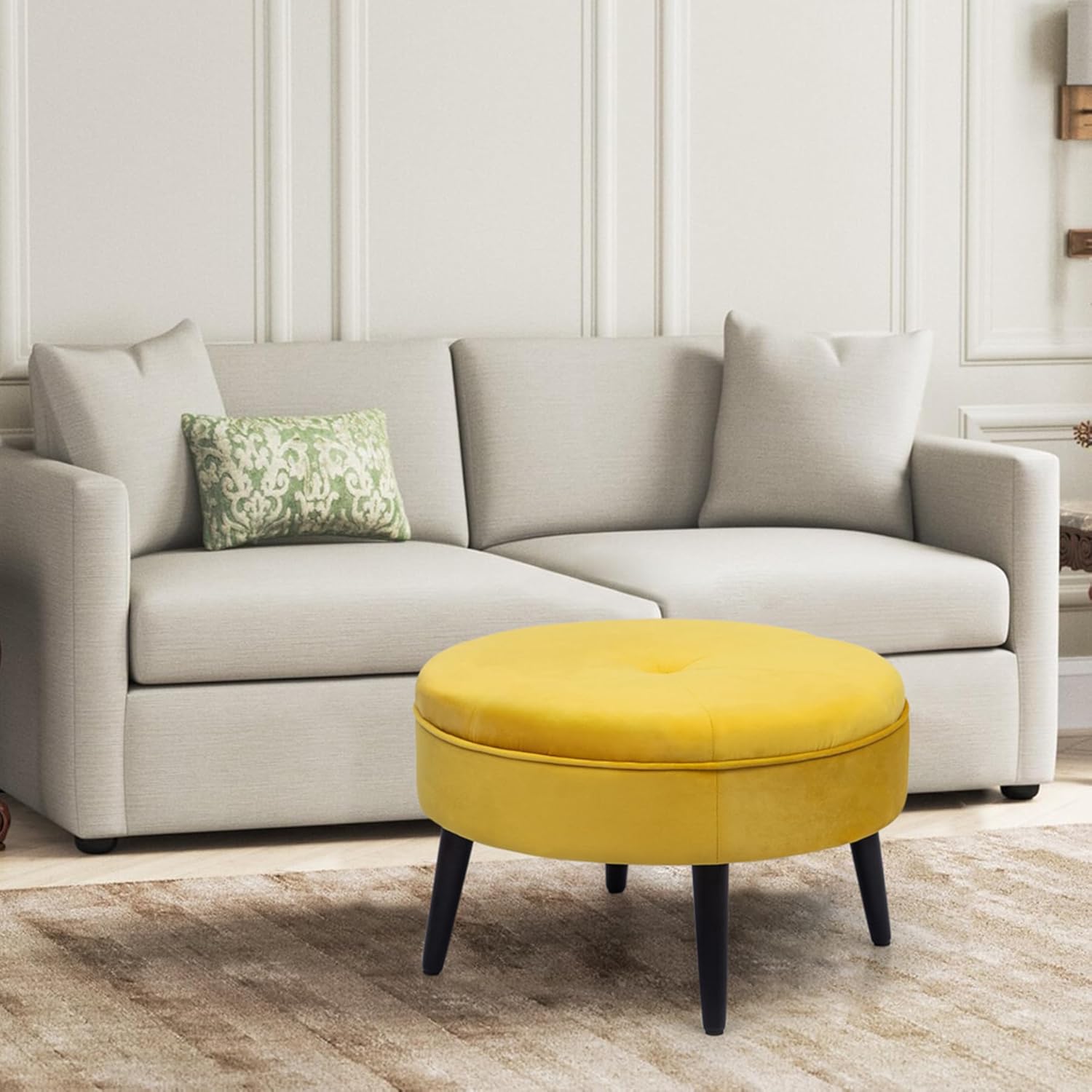 a yellow ottoman in a room